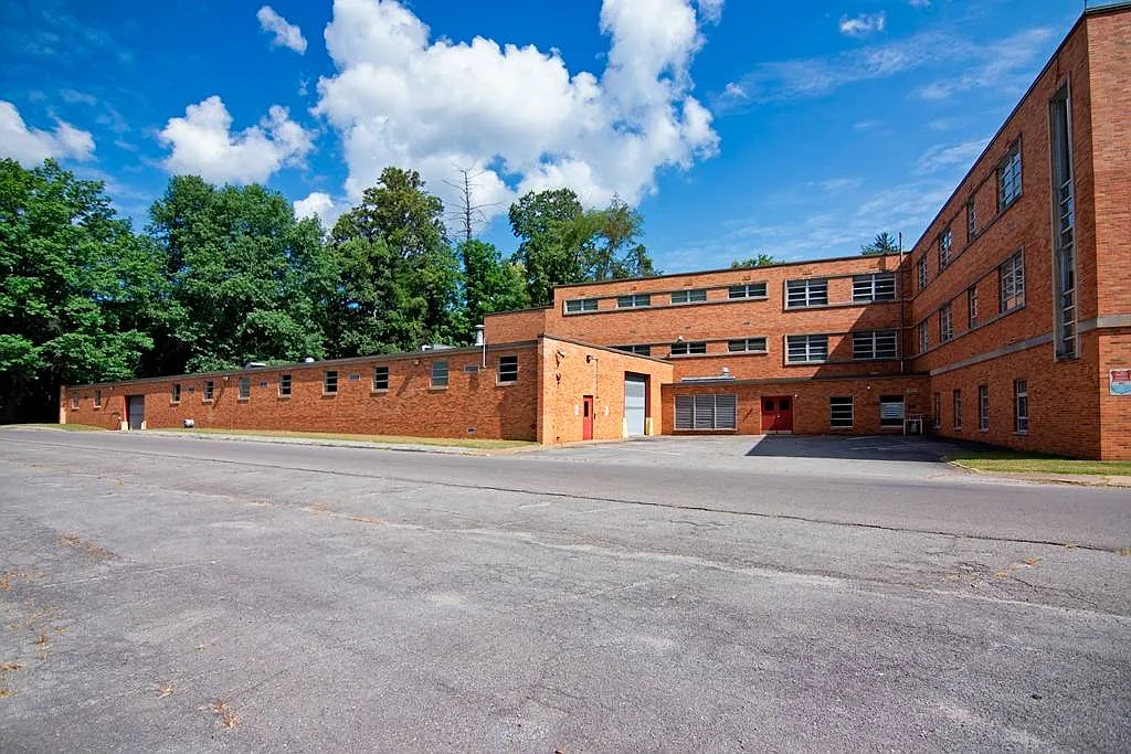 Exterior view of the building's wings and grounds