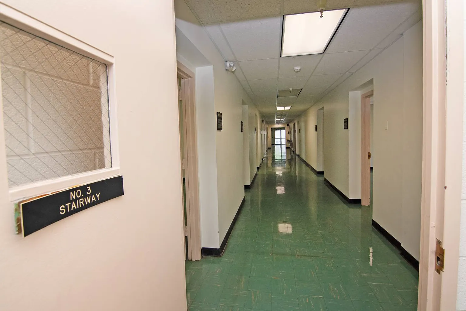A long institutional hallway inside the building